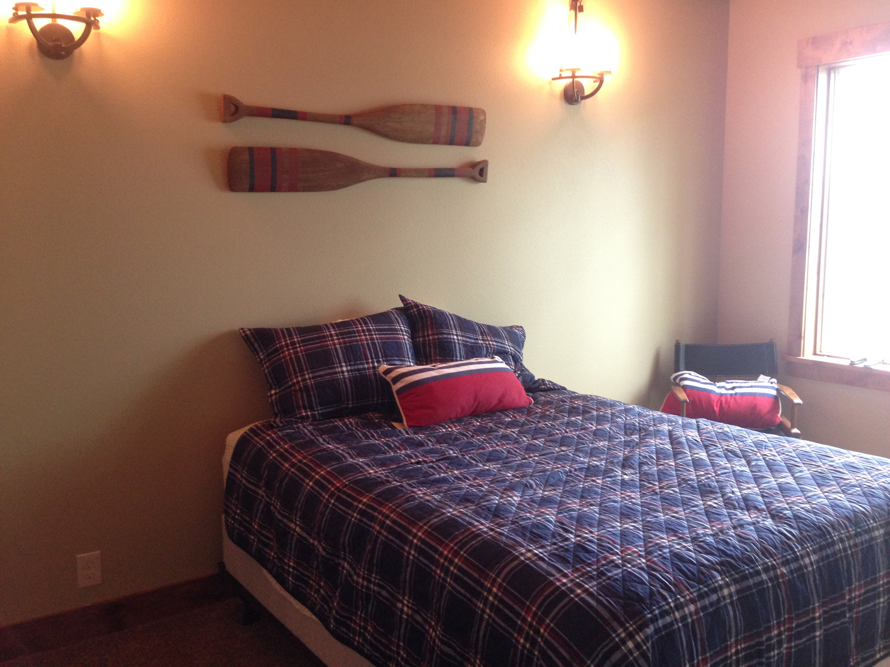 Bedroom view with wooden accent chair.