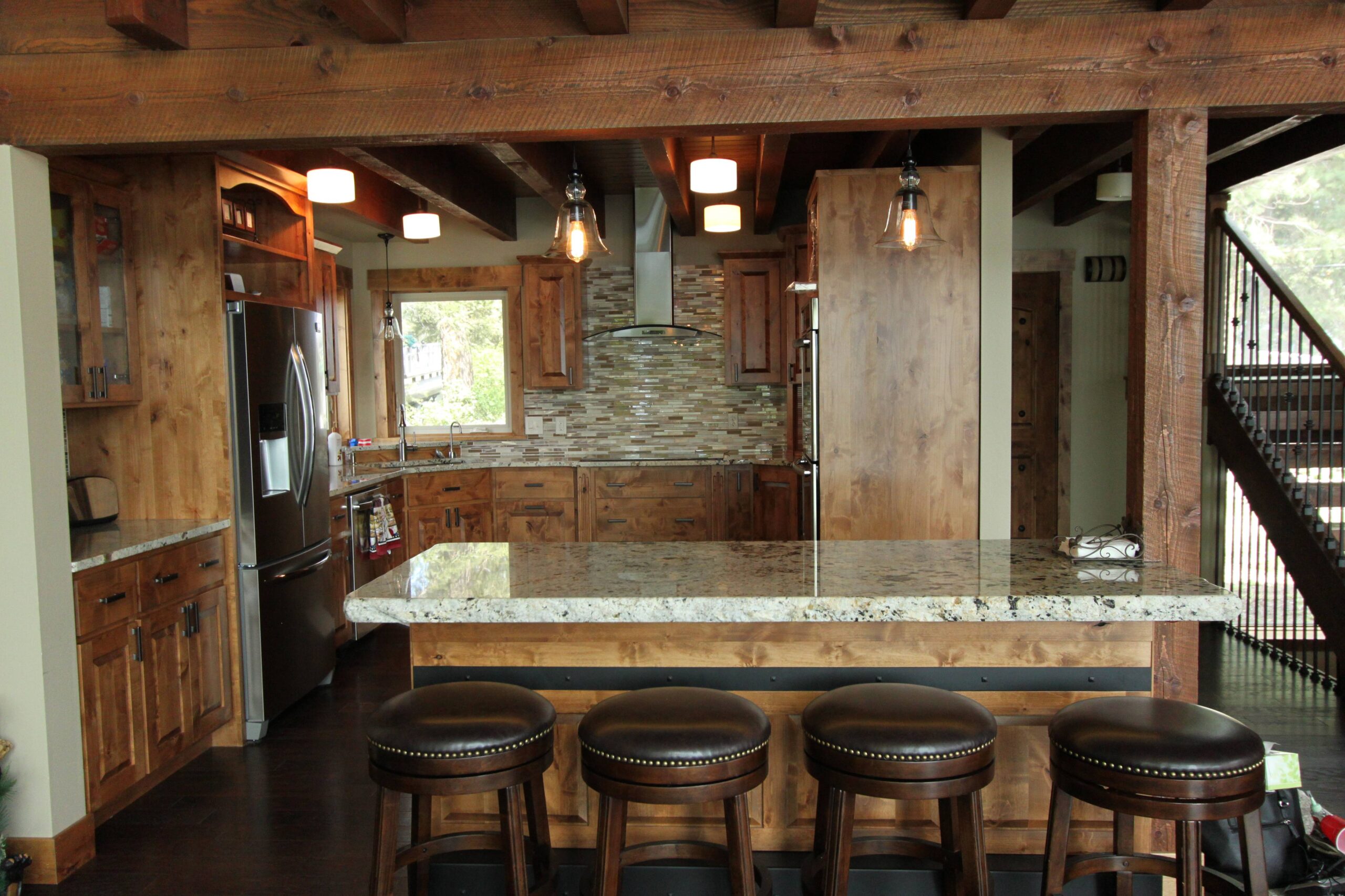 Full kitchen view with granite countertops.